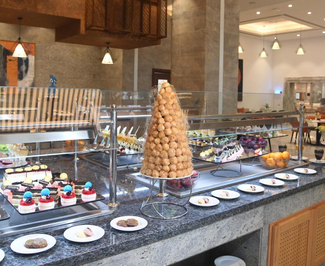 Tolip Resort El Galala Hills Ain Sukhna Exterior photo A dessert buffet